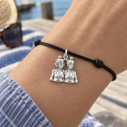 Whimsical Swimming Sisters Charm Bracelet – Personalized Bestie Gift – worn on the wrist on a black cord bracelet