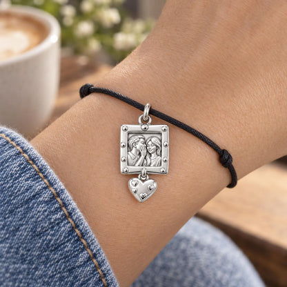 Whispered Secrets Portrait Charm Bracelet – Personalized Couple Gift – worn on the wrist on a black cord bracelet