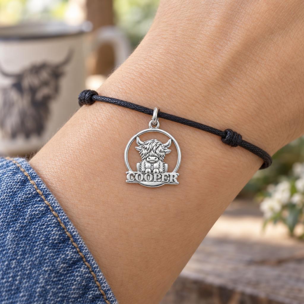 Wild and Woolly Highland Cow Charm Bracelet – Personalized Mom Gift – worn on the wrist on a black cord bracelet