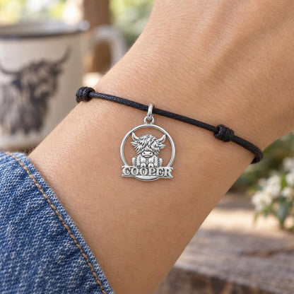 Wild and Woolly Highland Cow Charm Bracelet – Personalized Mom Gift – worn on the wrist on a black cord bracelet