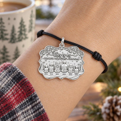 Winter Family Story Charm Bracelet – Personalized Mom Gift – worn on the wrist on a black cord bracelet