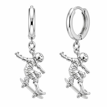 Young Skater in Motion Huggie Charm Earrings – silver, front view